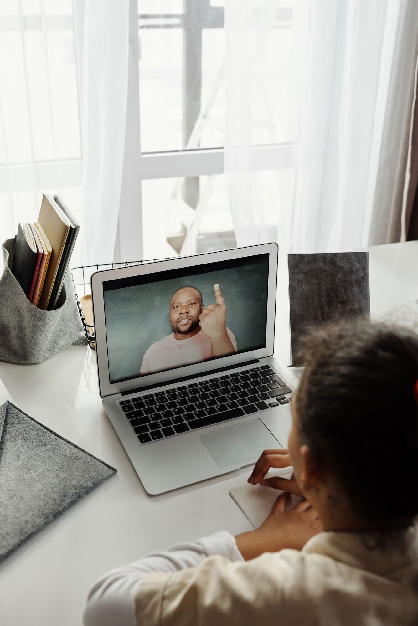 A GLS tutor teaches over a video call